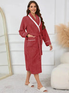 Trendsi plush navy lounge nightgown with contrast trim, tie waist, and pockets, perfect for cozy sleepwear.