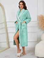 Trendsi plush navy lounge nightgown with contrast trim, tie waist, and pockets, perfect for comfortable sleepwear.