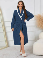 Trendsi plush navy lounge nightgown with contrast trim, tie waist, and pockets, featuring soft, cozy fabric for comfortable sleepwear.