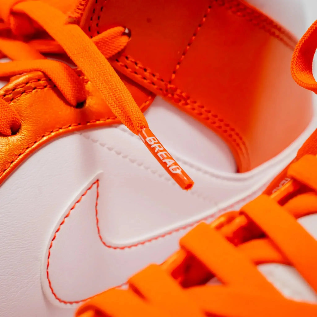 Coral orange elastic shoelace from Plush Fashion Hub, showing its stretchy, vibrant design suitable for sneakers and casual shoes.