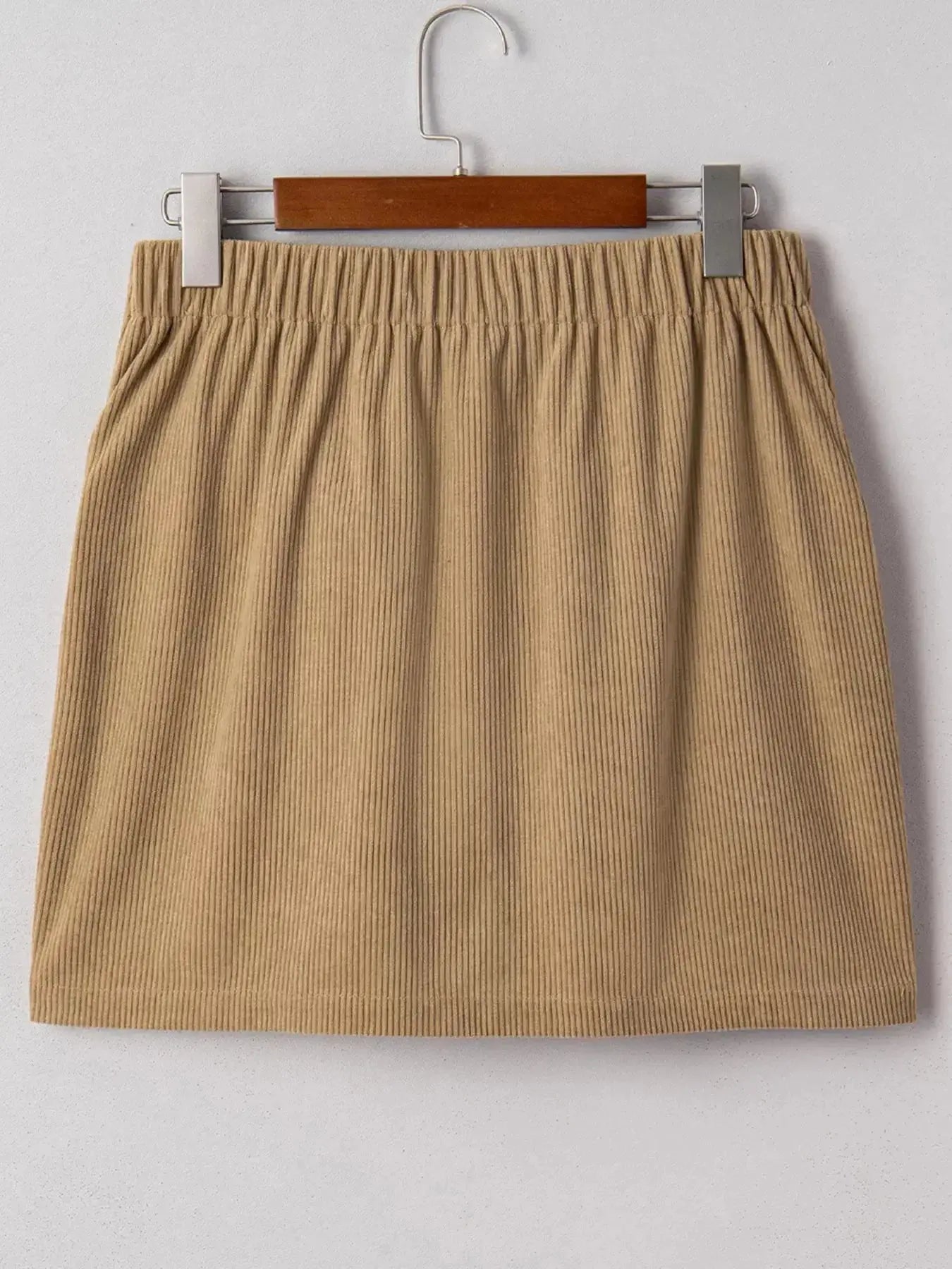 Women's high-waisted corduroy mini skirt with button-front closure, stylish and fitted from Plush Fashion Hub.