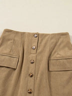 Women's high-waisted corduroy mini skirt with button front from Plush Fashion Hub, shown in a stylish, close-up view.