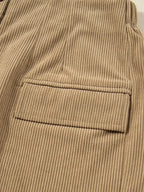 Women's high-waisted corduroy mini skirt with button front from Plush Fashion Hub, showcasing a stylish and trendy design.