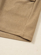 Women's high-waisted corduroy mini skirt with button-front closure, in a rich plush fabric from Plush Fashion Hub.