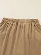 Women's high-waisted corduroy mini skirt with button front in a stylish, textured design by Plush Fashion Hub.