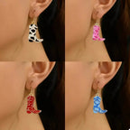 Gold-plated Western cowgirl boot dangle earrings by Plush Fashion Hub featuring playful statement jewelry design.