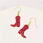 Gold-plated Western cowgirl boot dangle earrings by Plush Fashion Hub featuring playful Western-style footwear design.