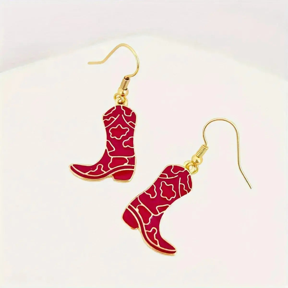 Gold-plated Western cowgirl boot dangle earrings by Plush Fashion Hub featuring playful Western-style footwear design.