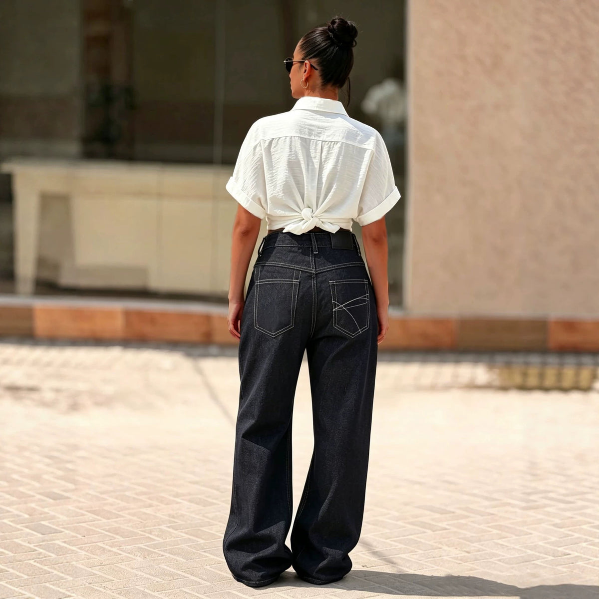 Women's black denim jeans with multi-button fly and straight leg style from Plush Fashion Hub.