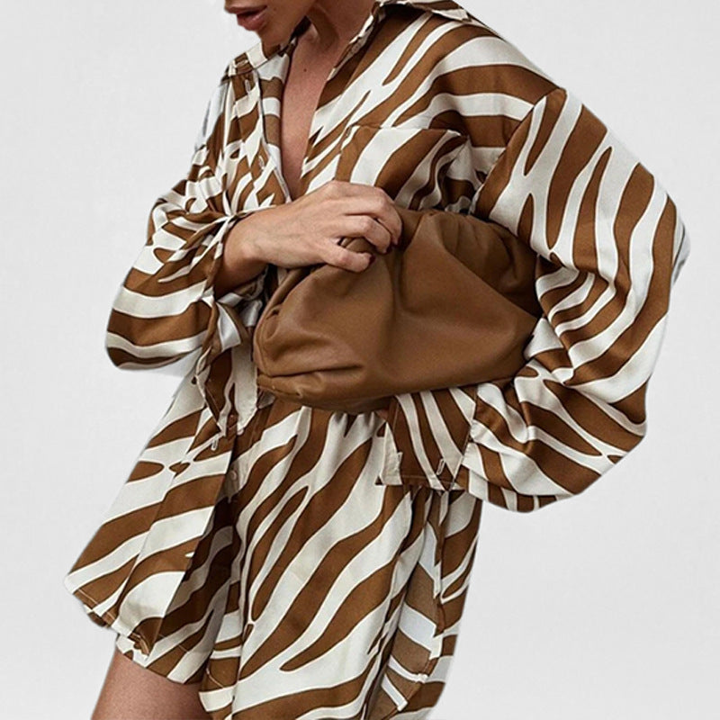 Printed short sleeve two-piece set by Plush Fashion Hub, featuring matching tops with colorful patterns and comfortable fit.