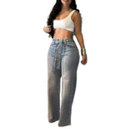 High-waisted, light wash wide-leg denim jeans embellished with scattered rhinestones and a matching crystal belt.