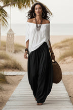 Women's one-shoulder T-shirt and wide-leg pants two-piece set by FitiqueFit, casual urban outfit, shown in a stylish streetwear look.