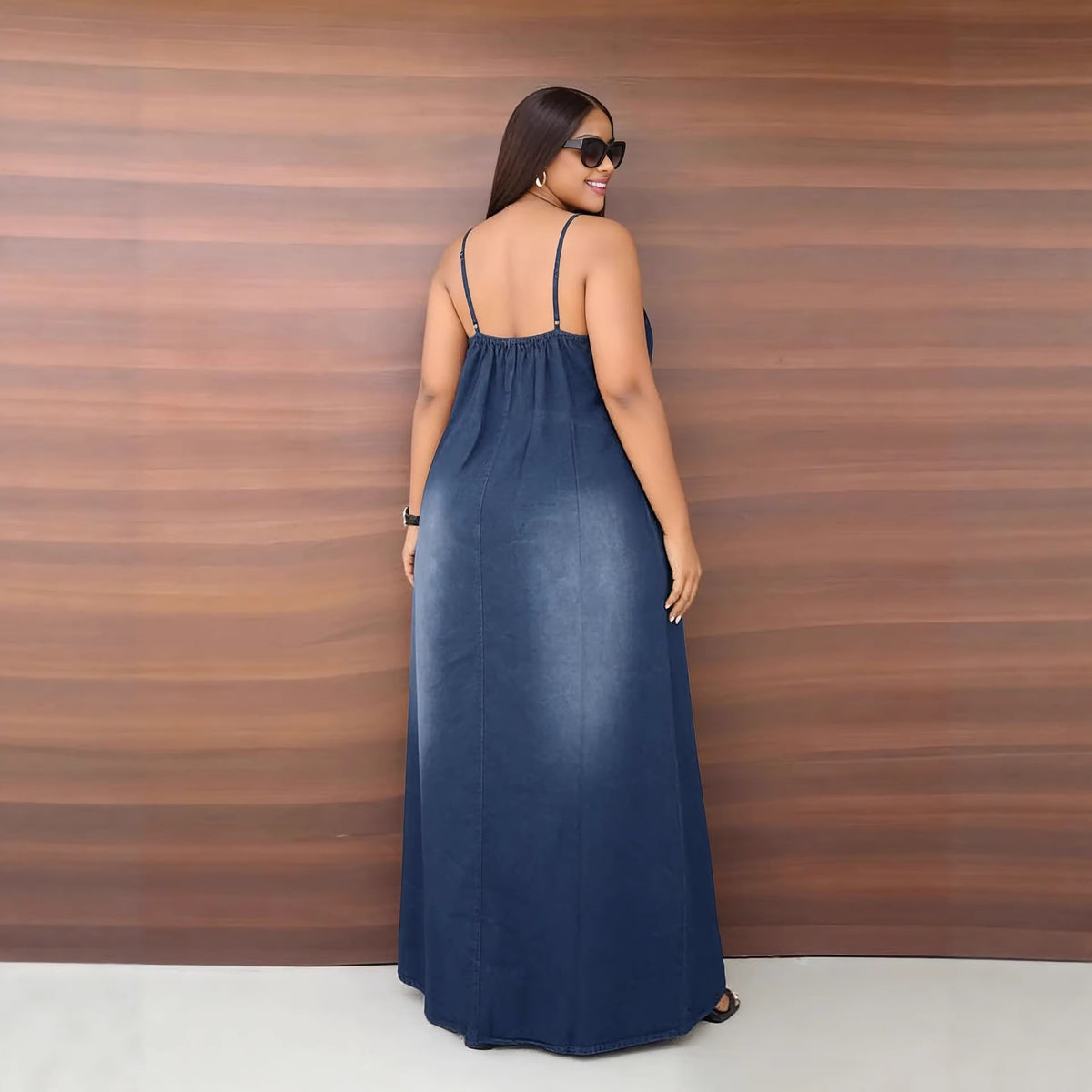 Casual faded denim dress with side pockets and loose straps, by eprolo, featuring a relaxed fit and stylish design.