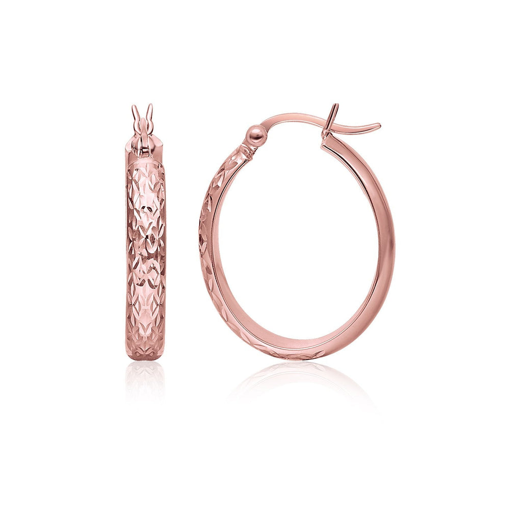 14k rose gold hammered oval hoop earrings showcasing shiny, textured surface on a jewelry display.