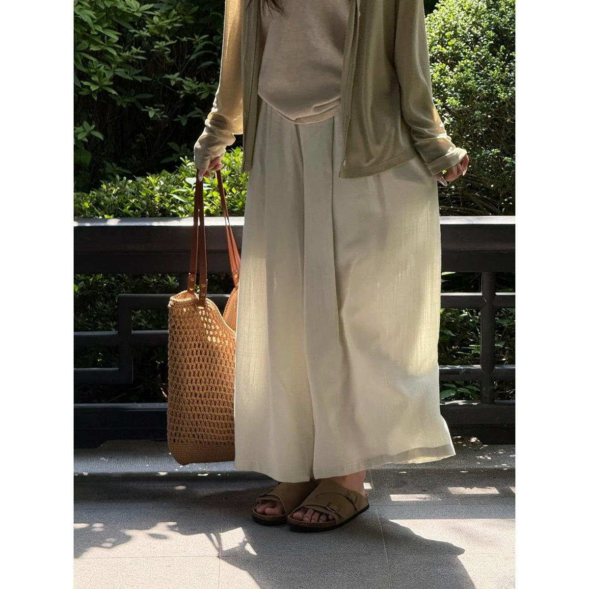 Elegant high-waisted wide-leg women's trousers from eprolo, shown in a neutral fabric with a flowing, relaxed fit.