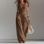 Eprolo V-neck button-front vest jumpsuit with sleeveless design and tailored fit, shown on a model with styled hair and accessories.
