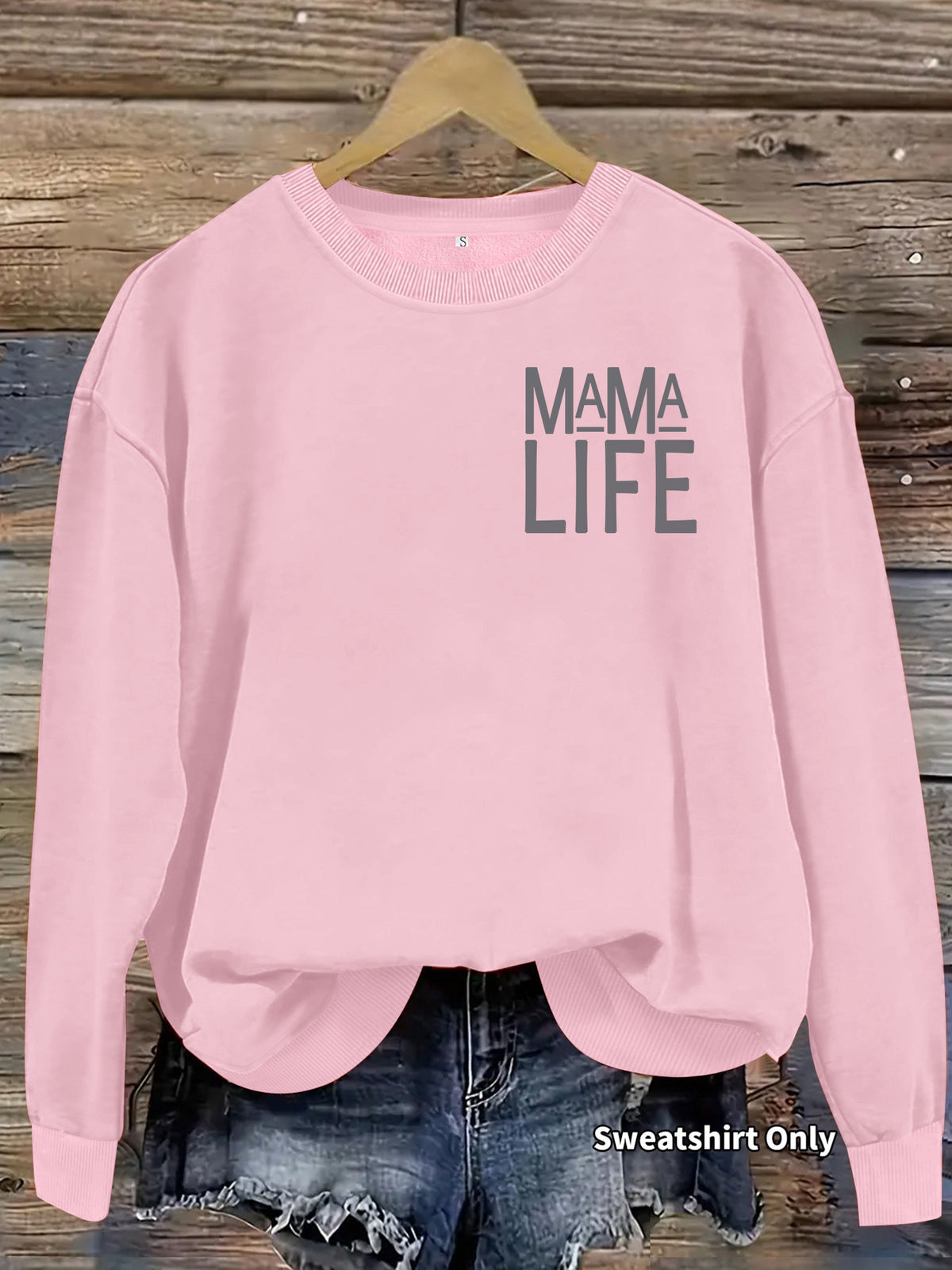 Pink cotton-blend crewneck sweatshirt featuring "MAMA LIFE" in gray print on the upper right chest.