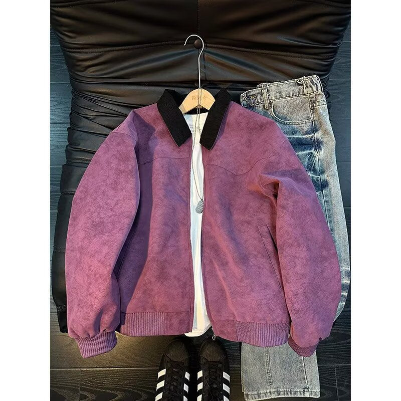 Purple suede jacket with black collar and ribbed trim over white shirt and jeans.