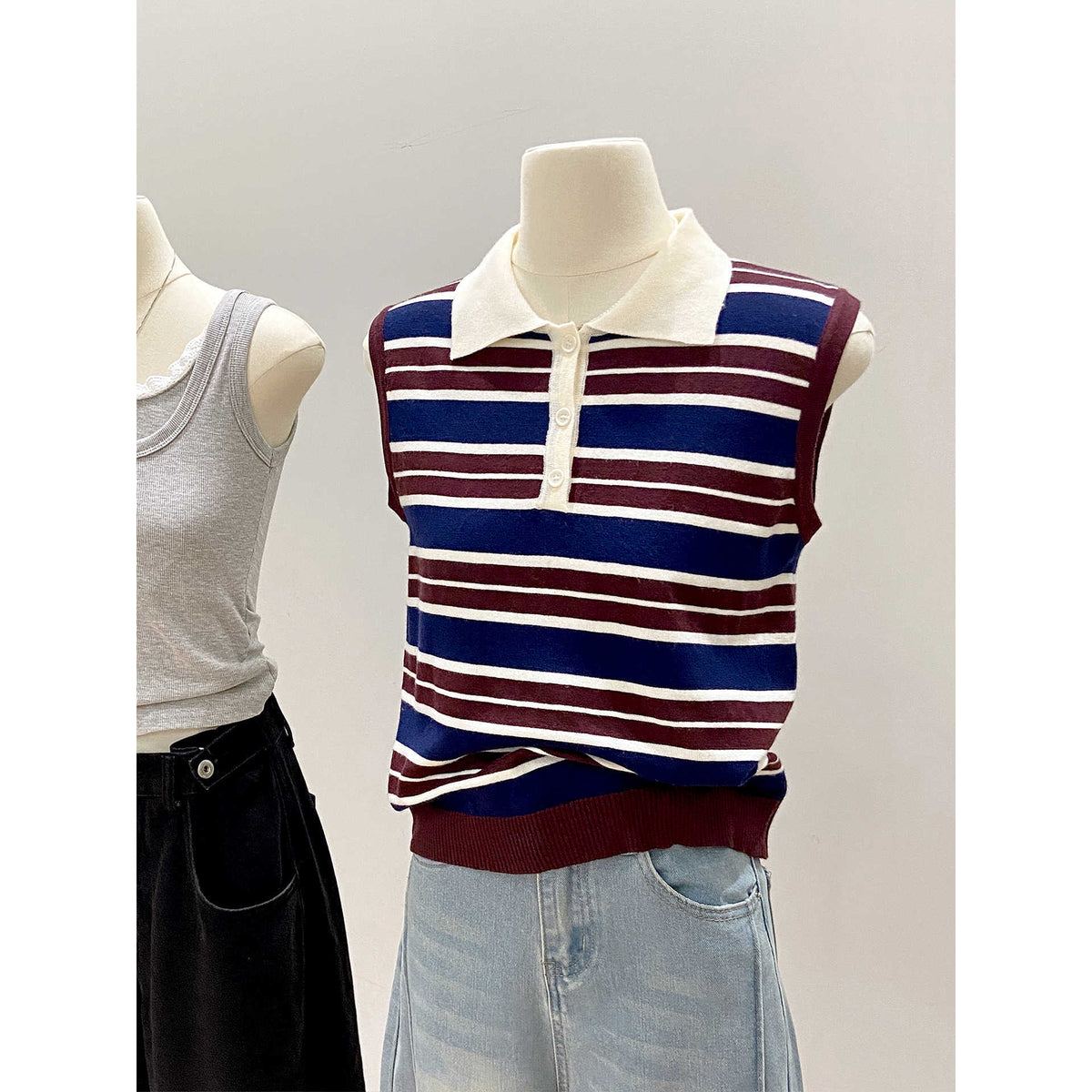 Color-blocked stripe knit vest for women by eprolo, featuring vibrant stripes and a cozy knit fabric.