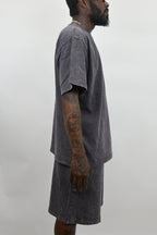 Stone washed clothing set from ARMOR JEANS featuring casual denim and fabric pieces, displayed on a neutral background.