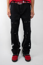 Armored Jeans RM206SK studded stacked cargo jeans with multiple pockets and metal stud embellishments, displayed folded on a white background.
