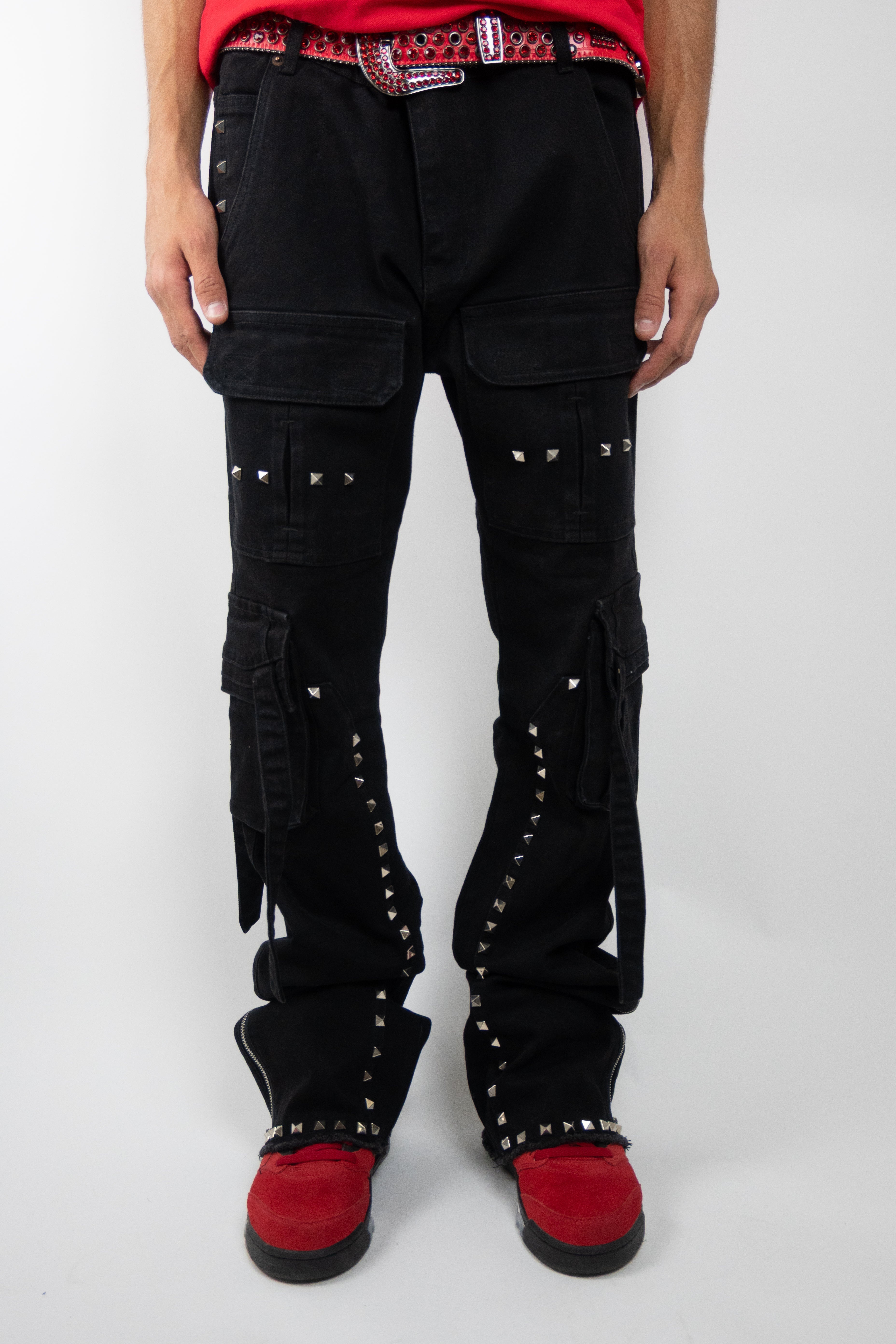 Armored Jeans RM206SK studded stacked cargo jeans with multiple pockets and metal stud embellishments, displayed folded on a white background.