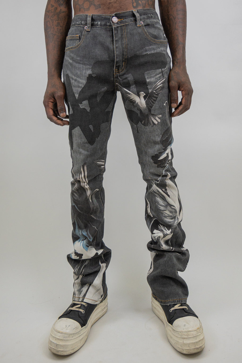 ARMOR JEANS RM204SK graphic printed stacked jeans showing distressed denim with bold graphic designs and layered style.