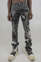 ARMOR JEANS RM204SK graphic printed stacked jeans showing distressed denim with bold graphic designs and layered style.