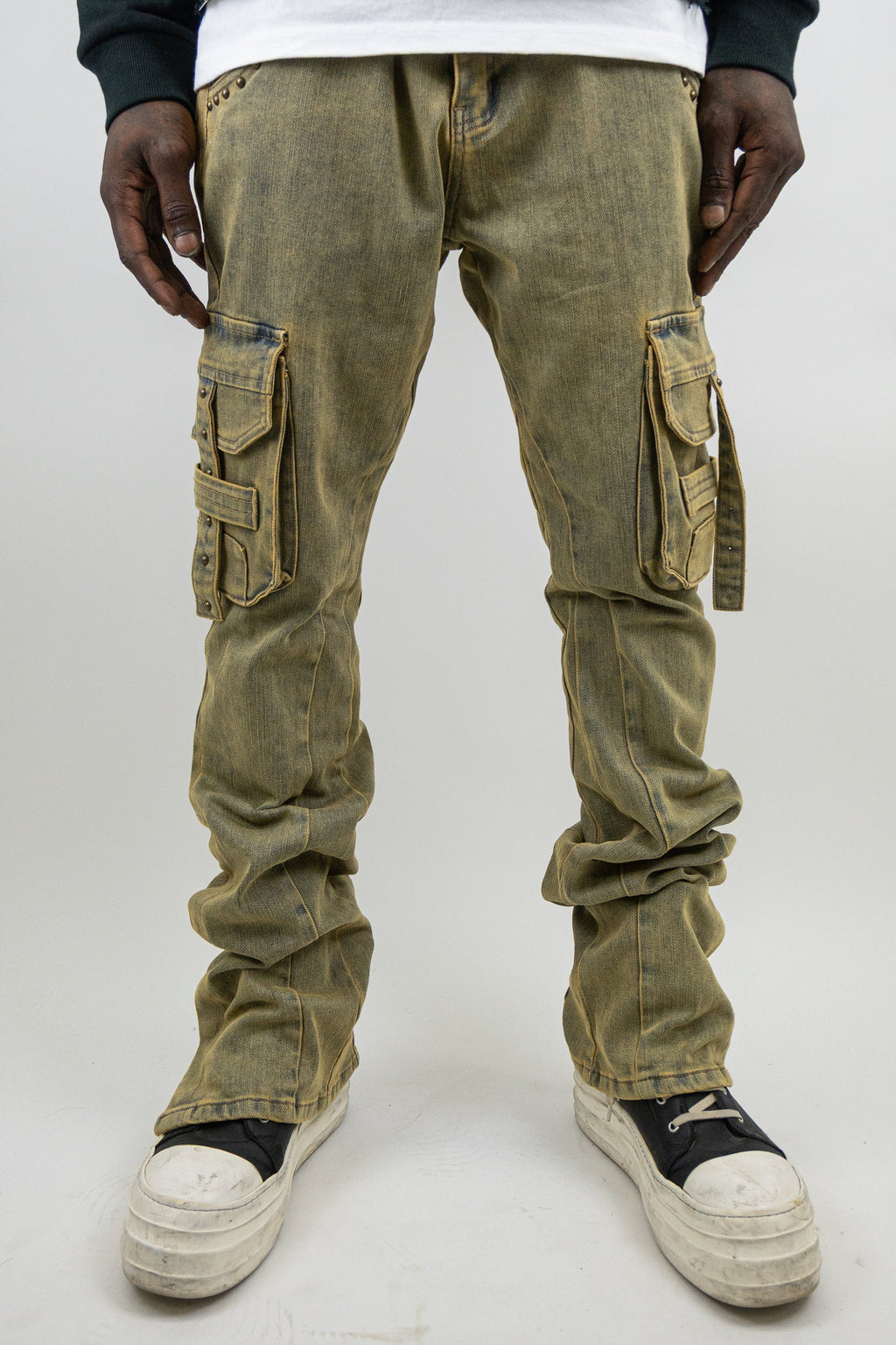ARMOR JEANS RM207SK studded stacked cargo jeans showing distressed denim, multiple pockets, and metal stud details.