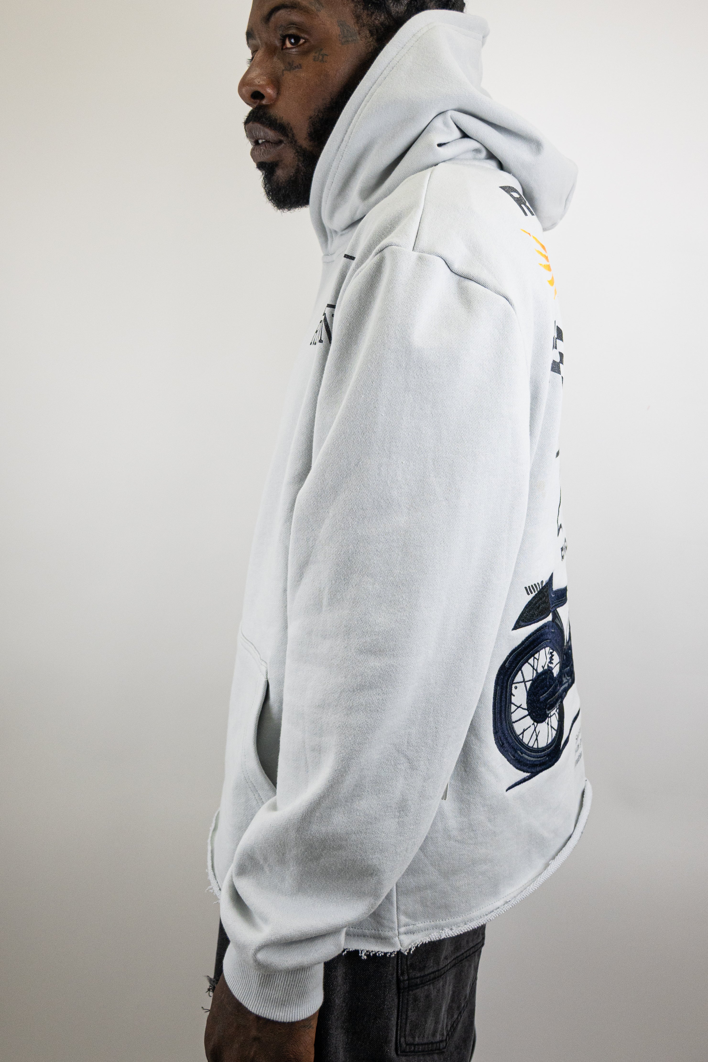 ARMOR JEANS RM1181C Moto Cropped Hoodie, black outerwear with a zip-up front and motorcycle-inspired design.