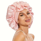 Double-layer satin hair bonnet with ribbon bow for hair protection, soft sleep cap from Plush Fashion Hub.