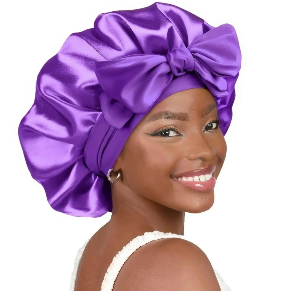 Double-layer satin ribbon hair bonnet with bow, plush fabric sleep cap for hair protection and styling.