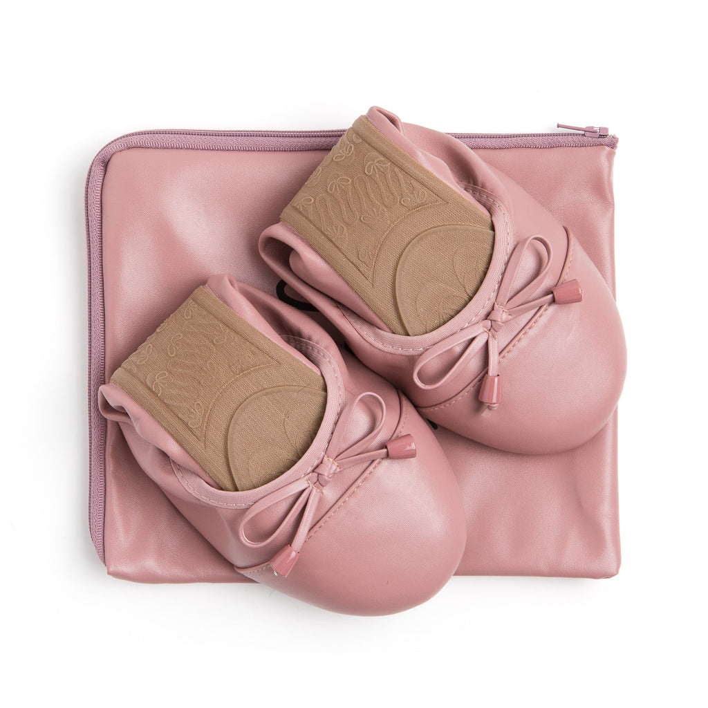 Talaria Flats dusty rose footwear folded on a bag, showcasing the stylish and comfortable design of these premium flats.