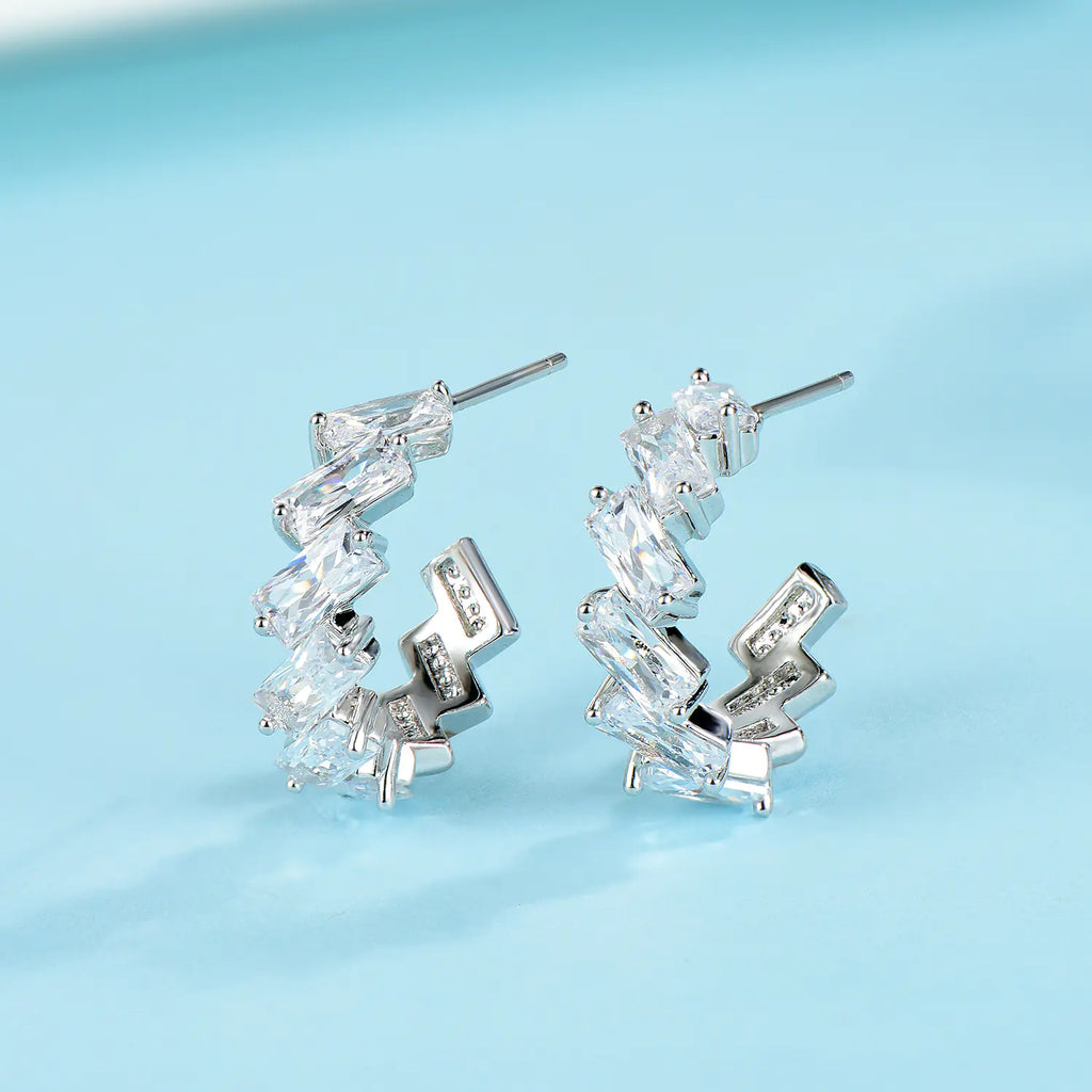 Minimalist 925 silver wave earrings and studs with sleek, modern design, perfect for everyday wear.
