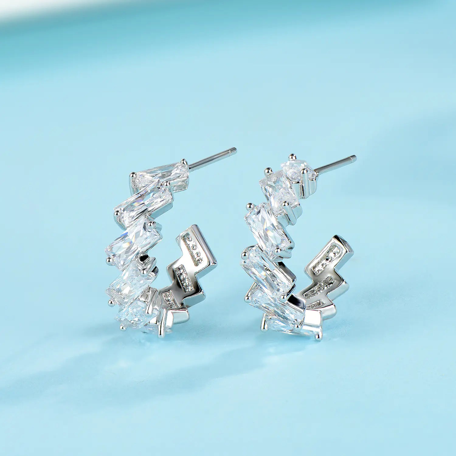 Minimalist 925 silver wave earrings and studs with sleek, modern design, perfect for everyday wear.
