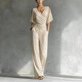 Women's V-neck slim fit straight leg jumpsuit by FitiqueFit, shown in a stylish, tailored design with a V-neck and sleek silhouette.