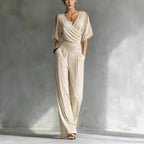 Women's V-neck slim fit straight leg jumpsuit by FitiqueFit, shown in a stylish, tailored design with a V-neck and sleek silhouette.