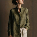 Women's loose-fit cotton linen long sleeve shirt with flip collar by FitiqueFit, shown in natural fabric and casual style.