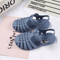 Girls hollow casual flat sandals in pink with open-toe design and adjustable straps, from Trendy Attic Store01.