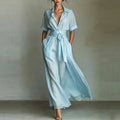 Women's solid color waist-slimming maxi dress with flip collar by FitiqueFit, showcasing a sleek, elegant silhouette.