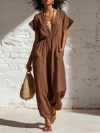 Women's deep V-neck three-quarter sleeve high waist wide-leg pants by Plush Fashion Hub, shown in a stylish, flowing design.