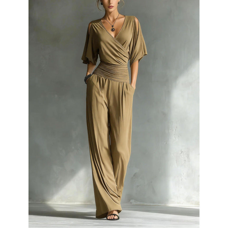 Women's slim fit V-neck jumpsuit with straight leg design by FitiqueFit, shown in a stylish, fitted silhouette.