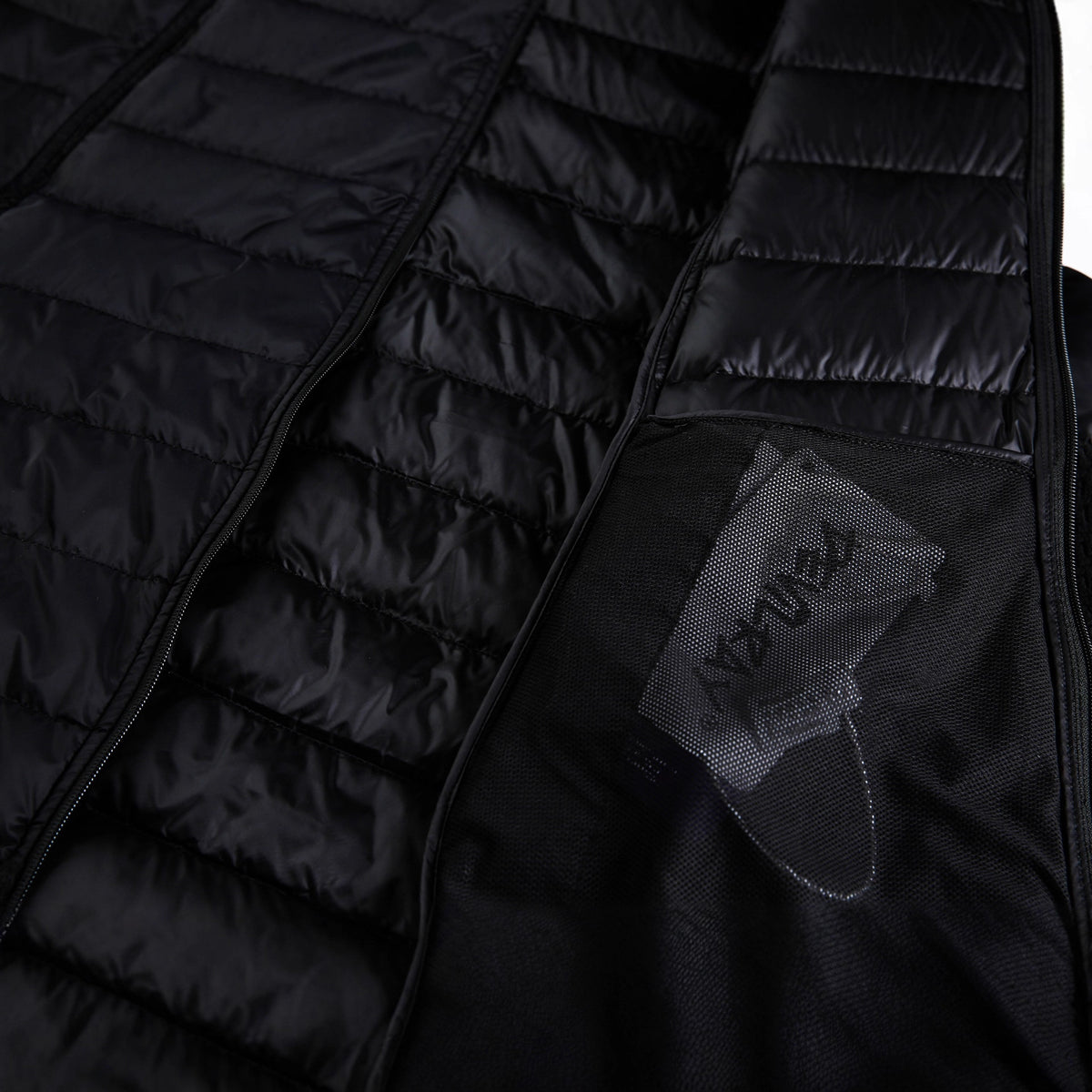 Black quilted nylon vest, interior mesh pocket with branded tag and zipper.