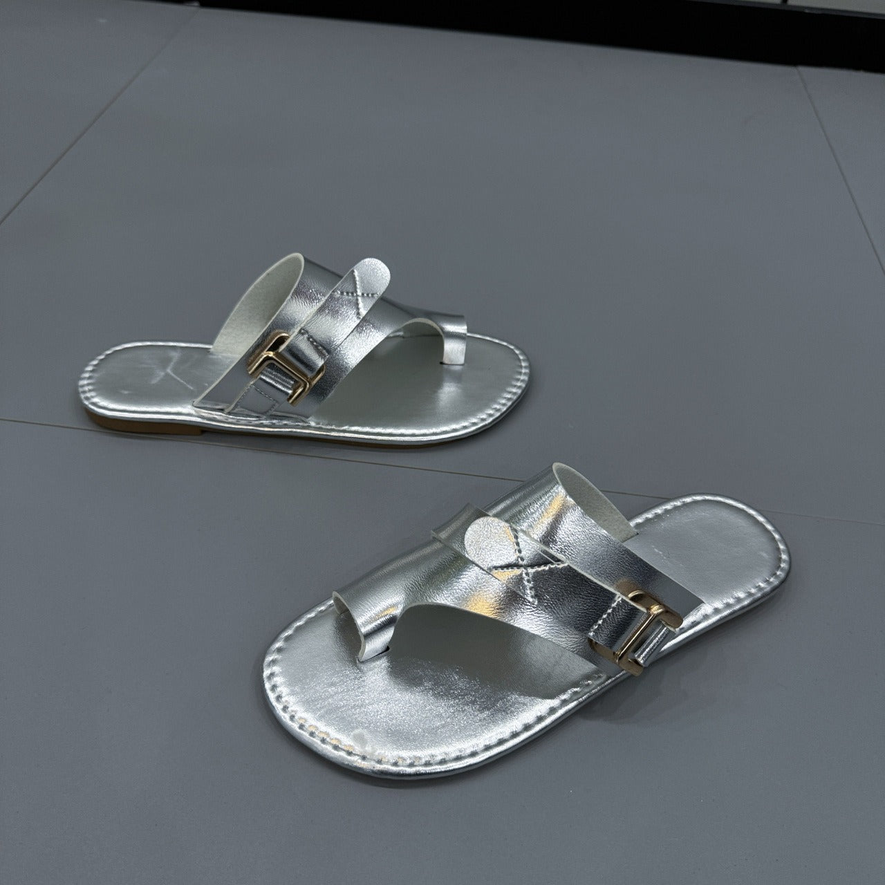 Elegant Plush Fashion Hub closed-toe flat sandals with sleek design, featuring a comfortable fit and stylish look.
