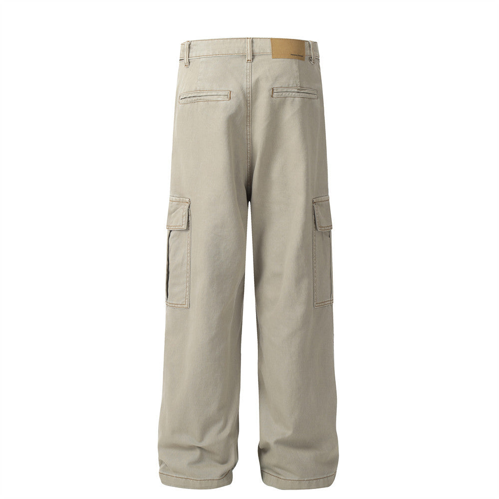 Beige cotton cargo pants, back view, straight style, side pockets, welt pockets, belt loops, and a brand patch.