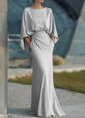 Women's silver backless pleated batwing sleeve maxi dress by FitiqueFit, featuring an elegant mermaid gown design and flowing silhouette.