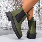 Women's ankle boots with elastic side panels, black slip-on footwear from Plush Fashion Hub featuring a modern, chic design.