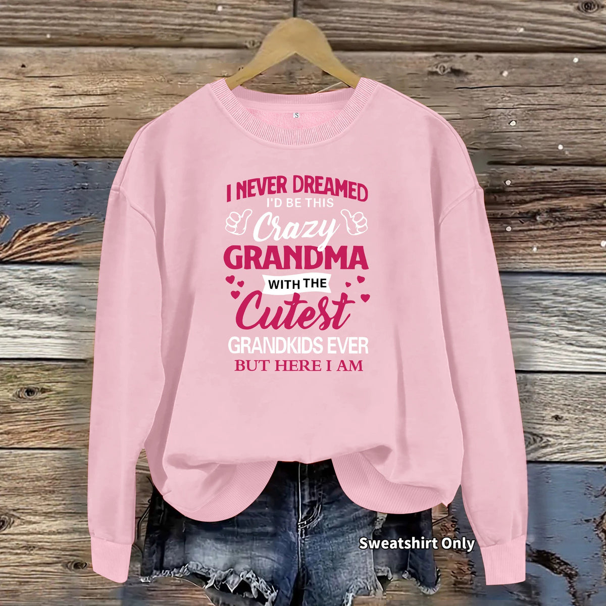Light pink cotton blend crewneck sweatshirt with dark pink graphic text on the front.