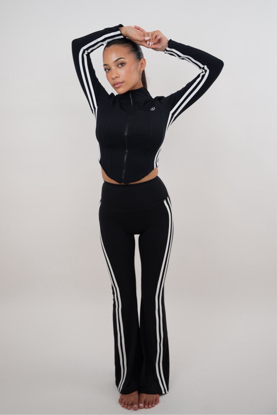 Black flare leggings for women by Plush Fashion Hub, featuring a stylish and comfortable fit with a flared leg design.