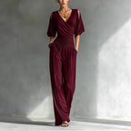 Women's V-neck slim fit straight leg jumpsuit by Plush Fashion Hub, shown in a stylish, fitted design on a model.